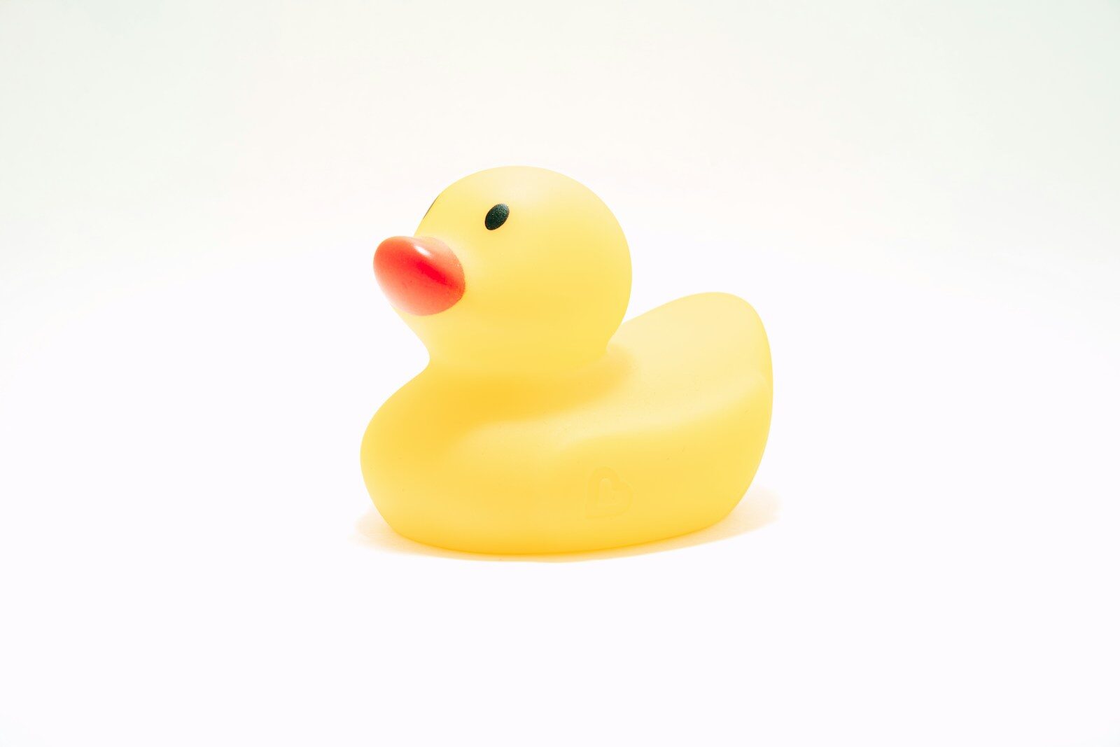 Photo by Timothy Dykes yellow rubber duck on white background