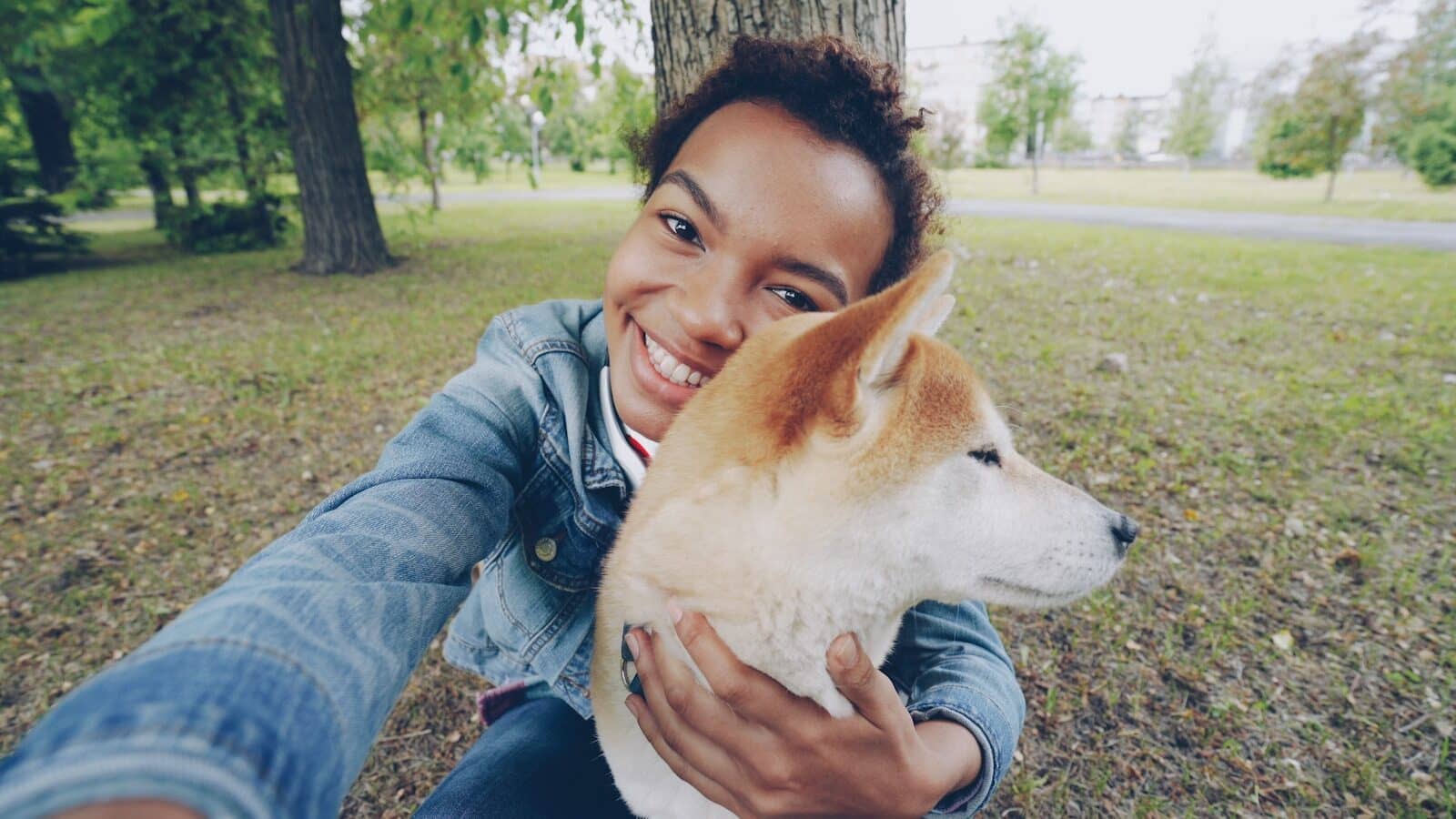 A person is taking a selfie with their dog. Why Pet Owners Need Professional Dog Sitters in Camp Springs Maryland